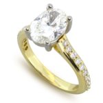 Diamond engagement two tone oval center ring